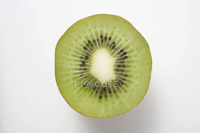 Half a kiwi fruit — Stock Photo