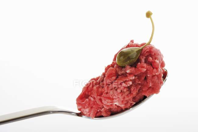 Spoonful of raw minced beef — Stock Photo