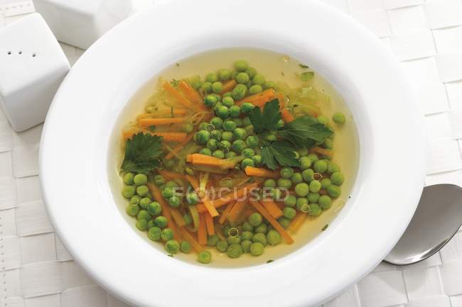 Vegetable soup with peas — Stock Photo