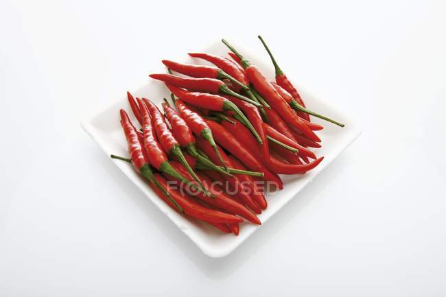 Chillies on the plastic tray — Stock Photo
