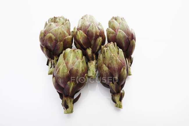 Purple baby artichokes — Stock Photo