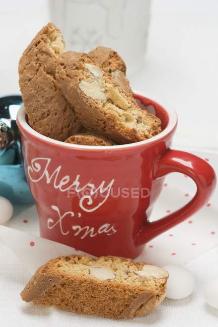 Cantucci in Christmassy cup — Stock Photo