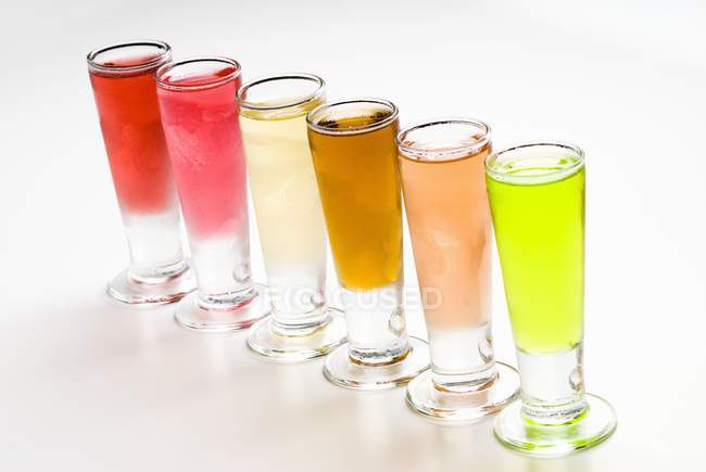 Glasses of Assorted Flavored Vodkas — Stock Photo