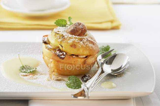 Baked apple with almonds and raisins — Stock Photo