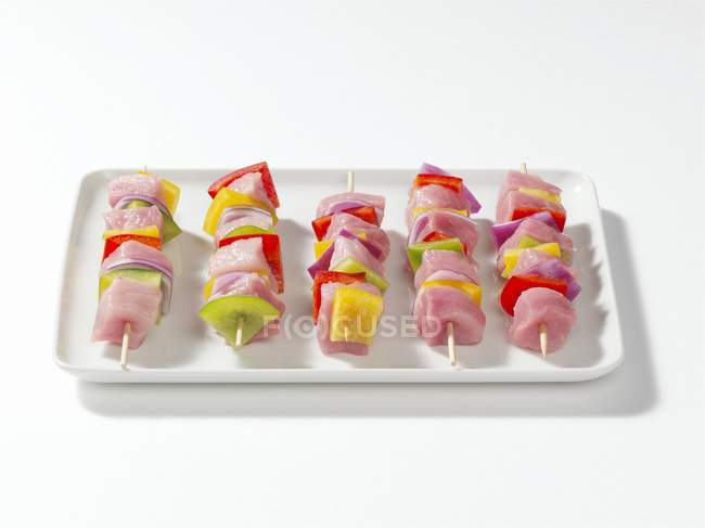 Meat kebabs on a platter — Stock Photo