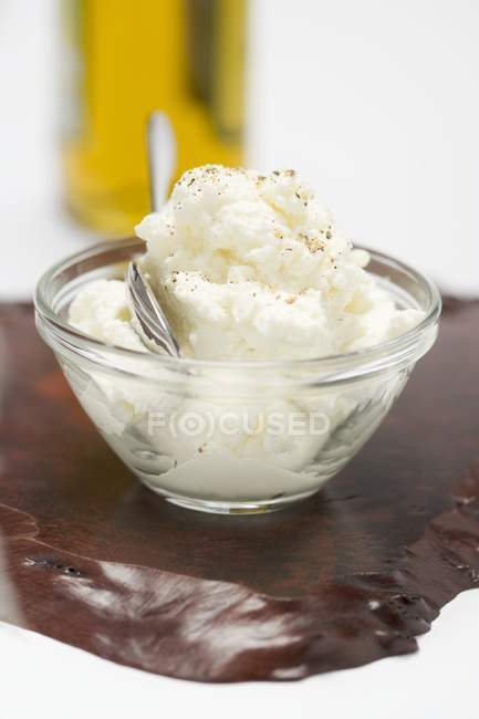 Closeup view of Quark in glass dish with spoon — Stock Photo