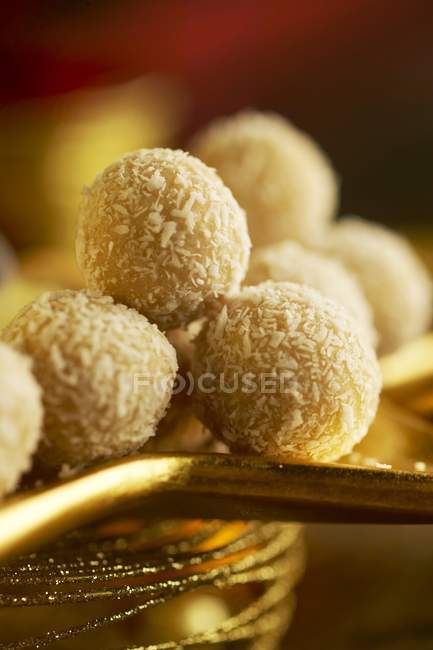 Closeup view of coconut truffles heap — Stock Photo