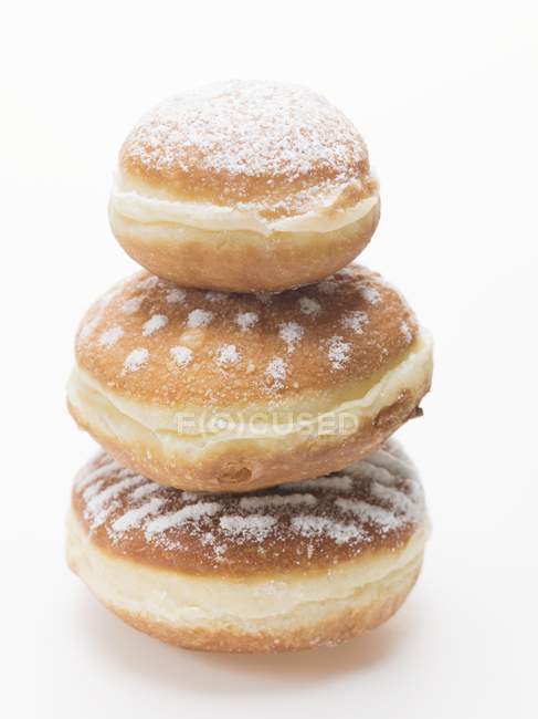 Three doughnuts dusted — Stock Photo