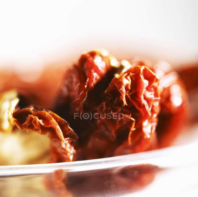 Dried tomatoes in bowl — Stock Photo