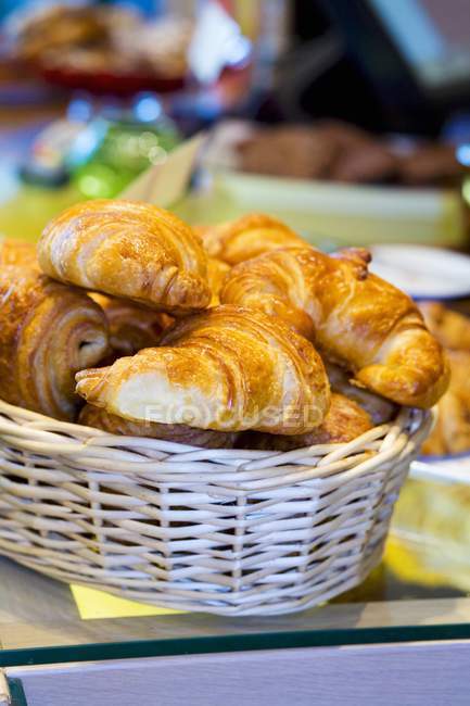 Woven basket of croissants — Stock Photo