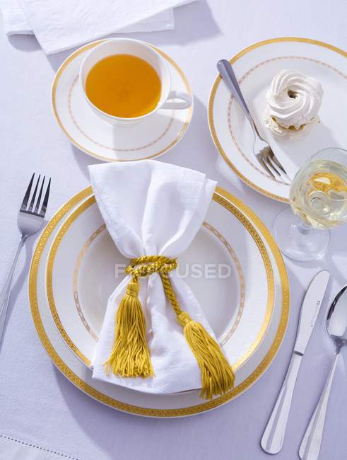 Place-setting with cup of tea — Stock Photo