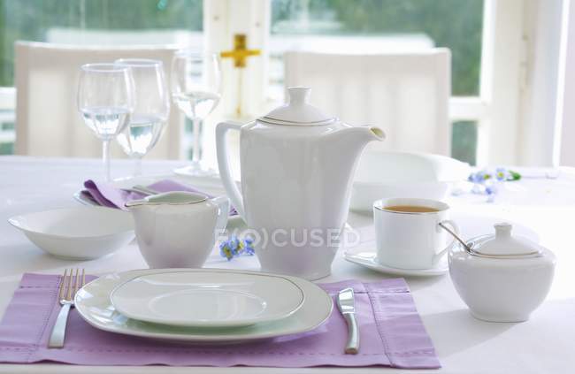 Place-setting with white tea things — Stock Photo