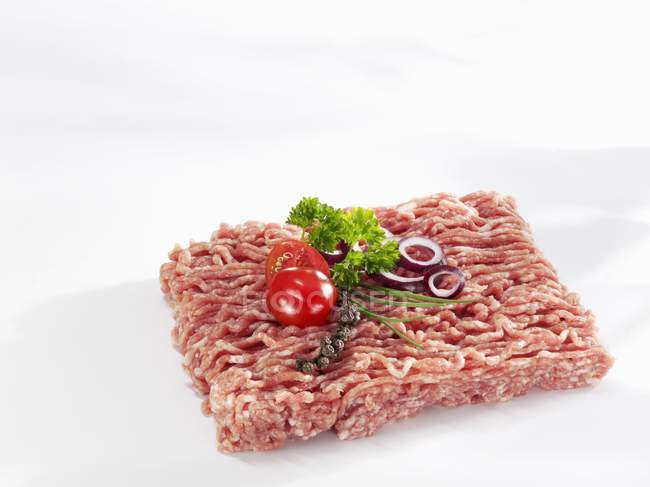 Minced pork with tomato and herbs — Stock Photo