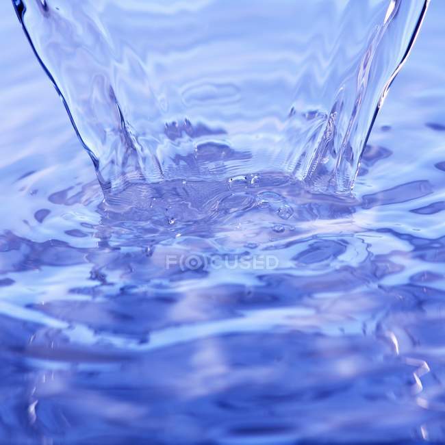 Closeup view of running blue water surface — Stock Photo