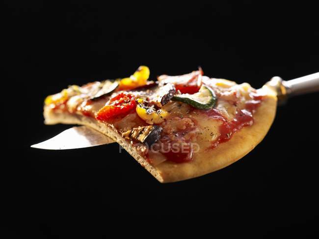 Slice of grilled vegetable pizza — Stock Photo
