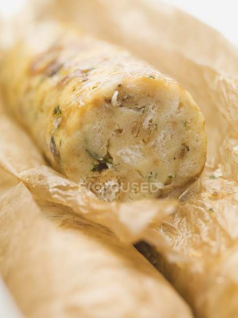 Closeup view of napkin dumpling in baking parchment — Stock Photo