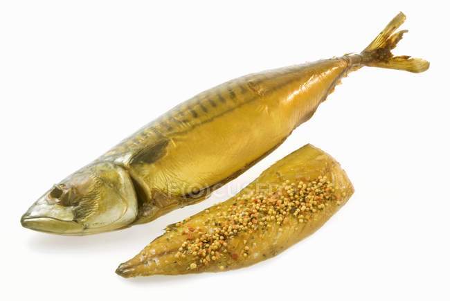 Closeup view of smoked mackerel and seasoned smoked fillet — Stock Photo