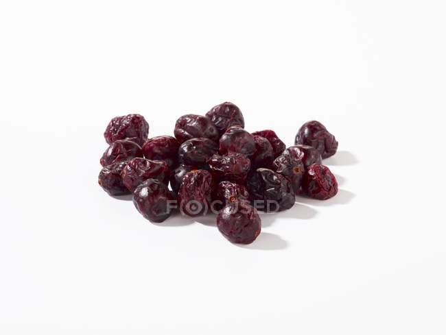 Dried cranberries on white — Stock Photo