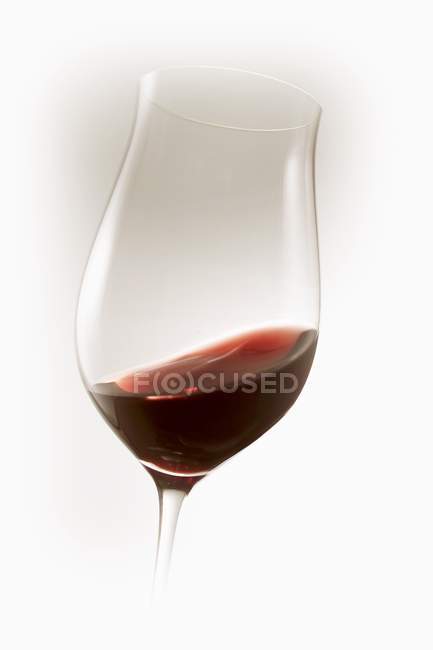 Red wine swirling in glass — Stock Photo