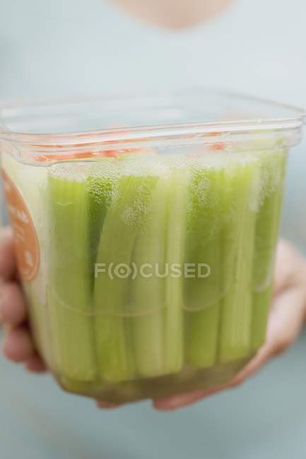 Woman holding container — Stock Photo