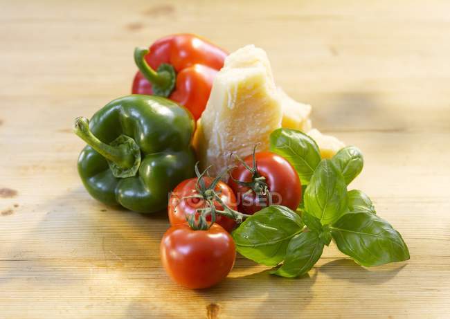 Tomatoes with peppers and Parmesan cheese — Stock Photo