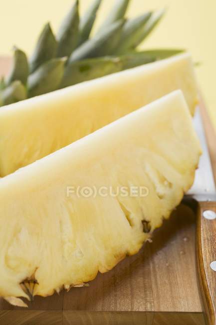 Pineapple on chopping board — Stock Photo
