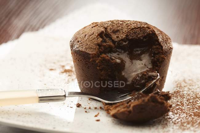 Chocolate pudding on plate and on table — Stock Photo
