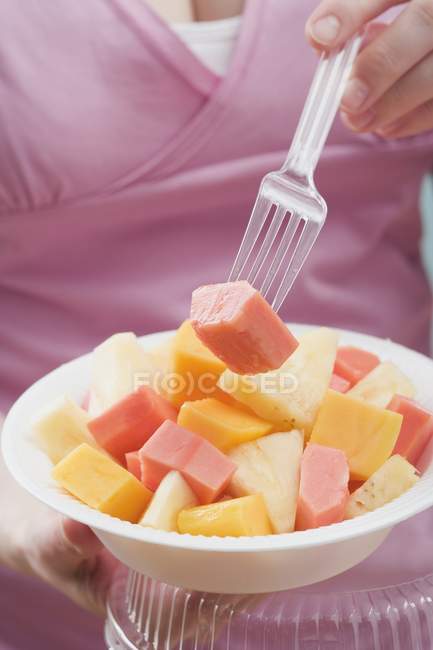 Woman eating  with fork — Stock Photo