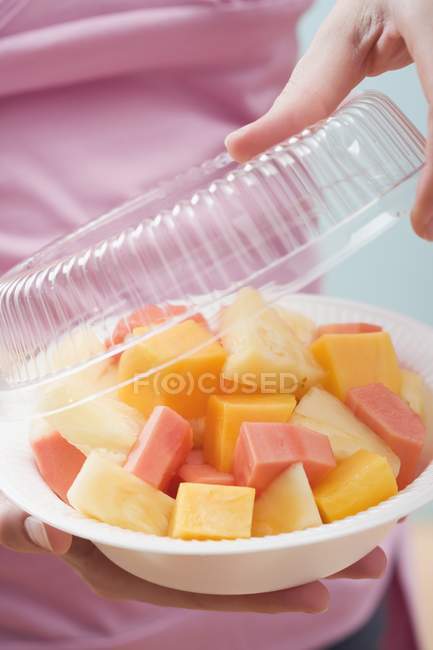 Woman removing lid — Stock Photo