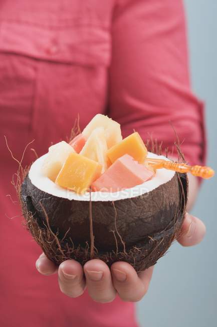 Woman holding coconut — Stock Photo