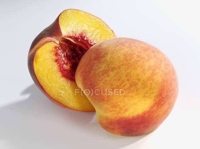 Halved yellow peach — Stock Photo