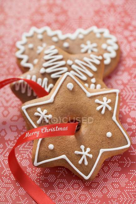 Gingerbread with red ribbon — Stock Photo
