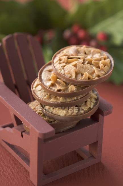 Christmas sweets on chair — Stock Photo