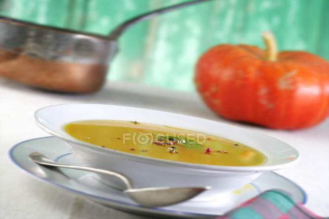 Pumpkin soup with pepper corns — Stock Photo