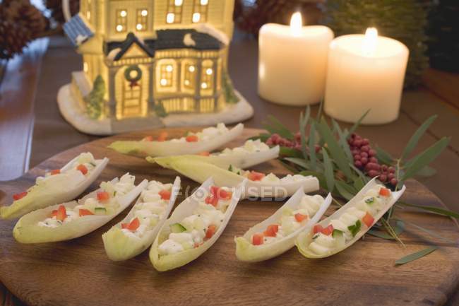 Filled chicory boats for Christmas — Stock Photo