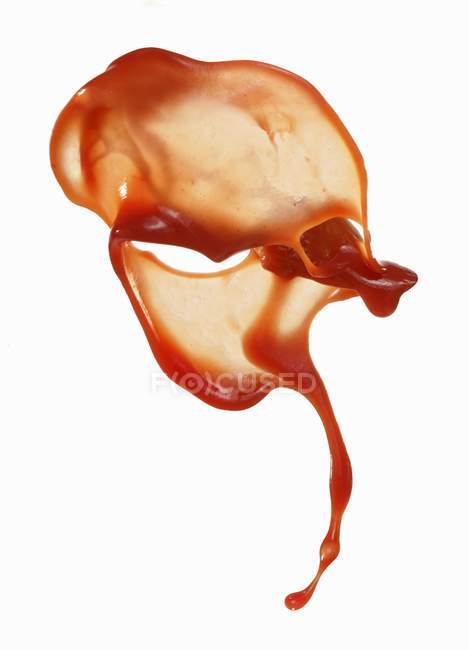 Squirted tomato sauce on white surface — Stock Photo