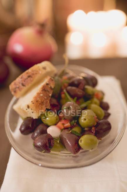 Marinated olives with bread — Stock Photo