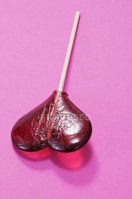 Heart-shaped lollipop, close-up — Stock Photo