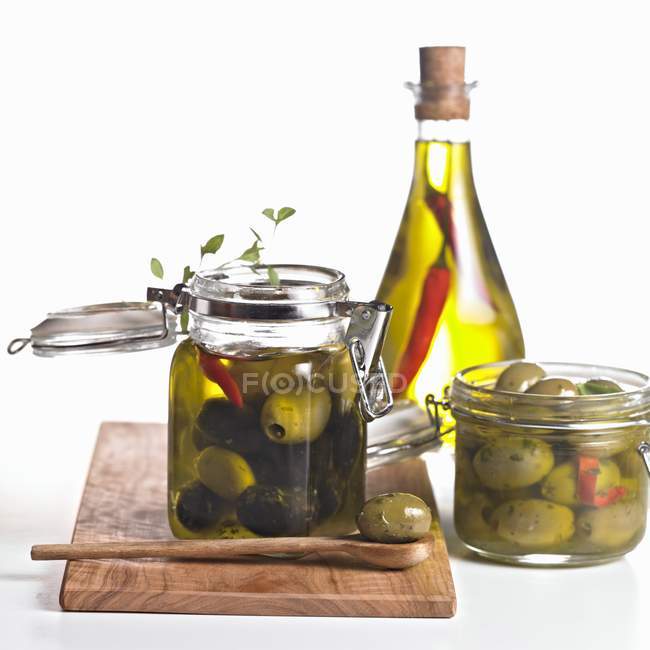 Pickled olives in jars — Stock Photo