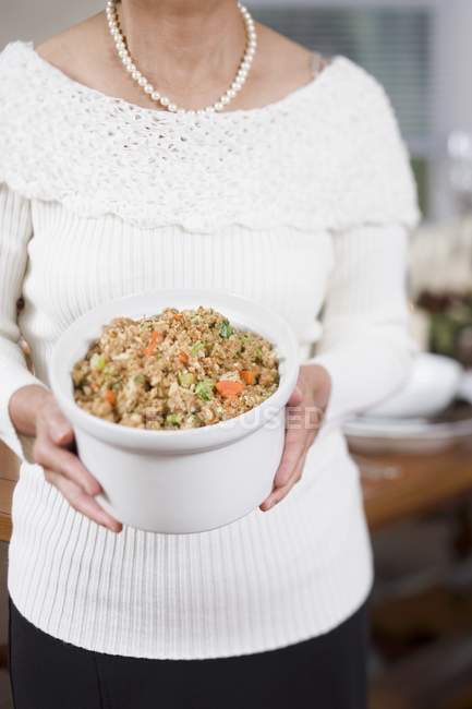 Hands holding bowl — Stock Photo