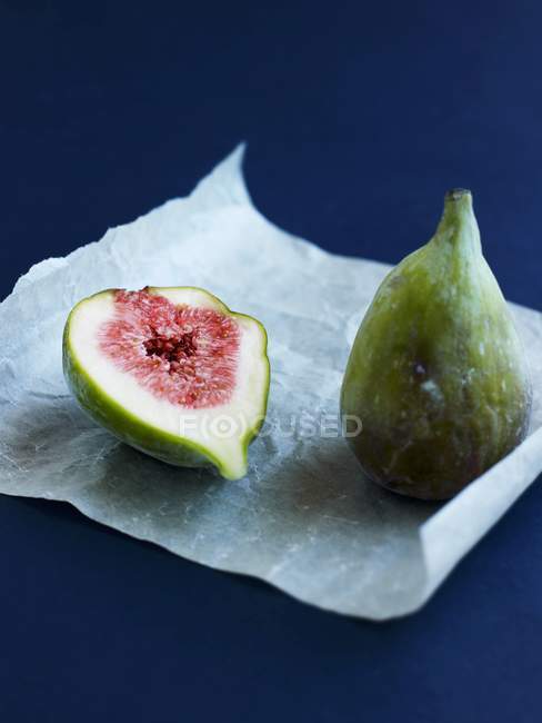 Figs on parchment paper — Stock Photo