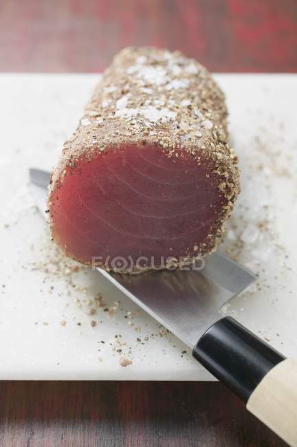 Raw tuna fillet with salt — Stock Photo