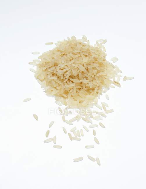 Long-grain rice spilled — Stock Photo