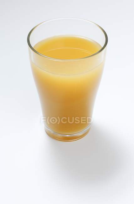 Bicchiere di succo multivitaminico — Foto stock