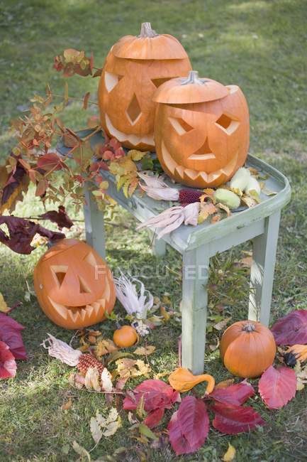 Decoration with carved pumpkins — Stock Photo