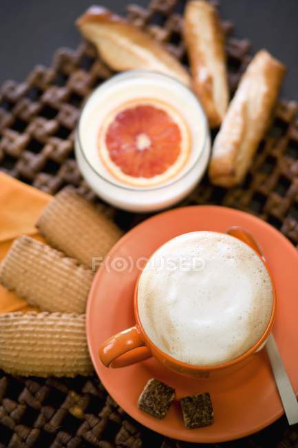 Breakfast with cappuccino and biscuits — Stock Photo