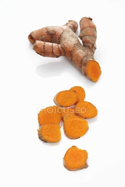 Partly sliced Turmeric root — Stock Photo