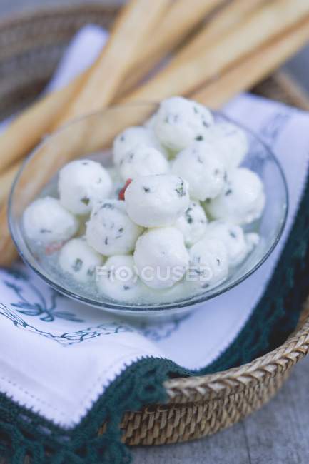 Marinated mozzarella balls with grissini — Stock Photo