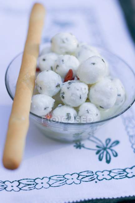Marinated mozzarella balls with grissini — Stock Photo