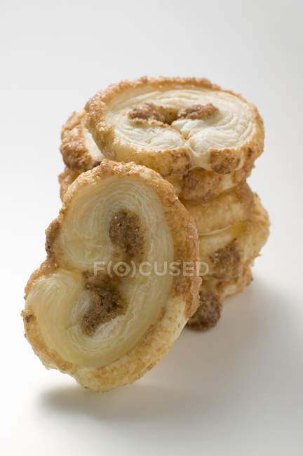 Biscuits stacked on white — Stock Photo